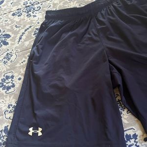 New Men’s Under Armour training shorts blue in color size medium.